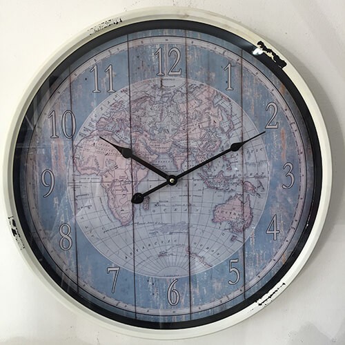 Wall clock featuring an antique atlas background and distressed finish